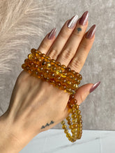 Load image into Gallery viewer, Blue Amber bracelet, amber beaded bracelet on hand
