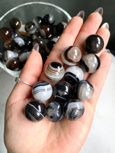 Load image into Gallery viewer, Mini Banded Black Agate &amp; Quartz Spheres
